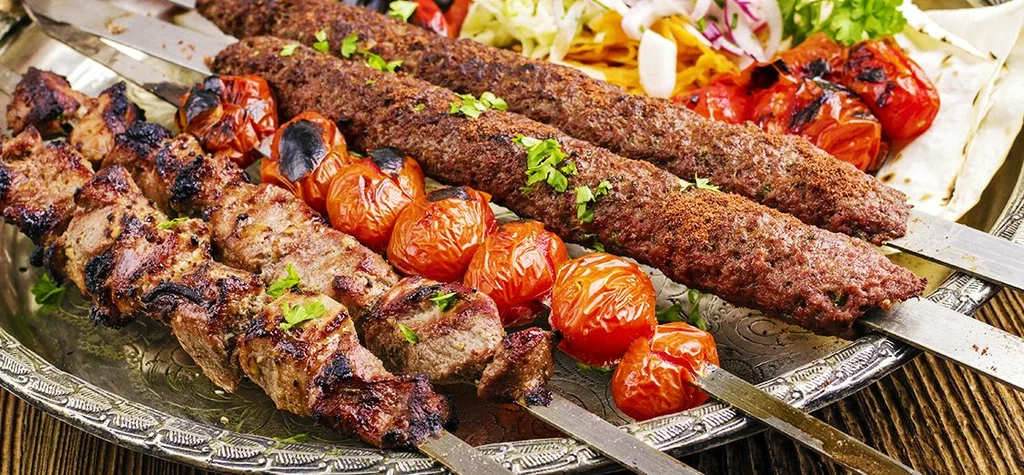 Traditional Azerbaijani chicken and lamb kebabs with grilled vegetables