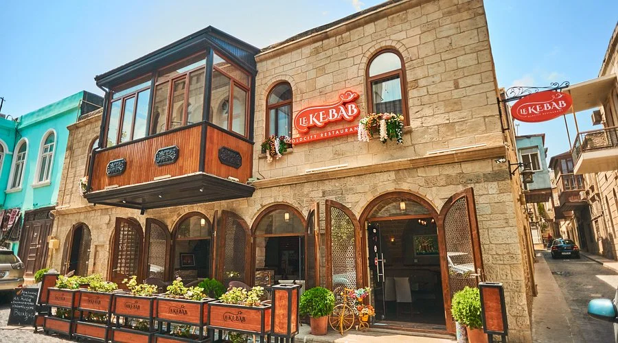 Expat looking at the city skyline to calculate the cost of living and rent in Baku 2026