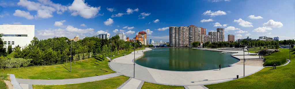 Dede Gorgud Park green area and lake in central Baku
